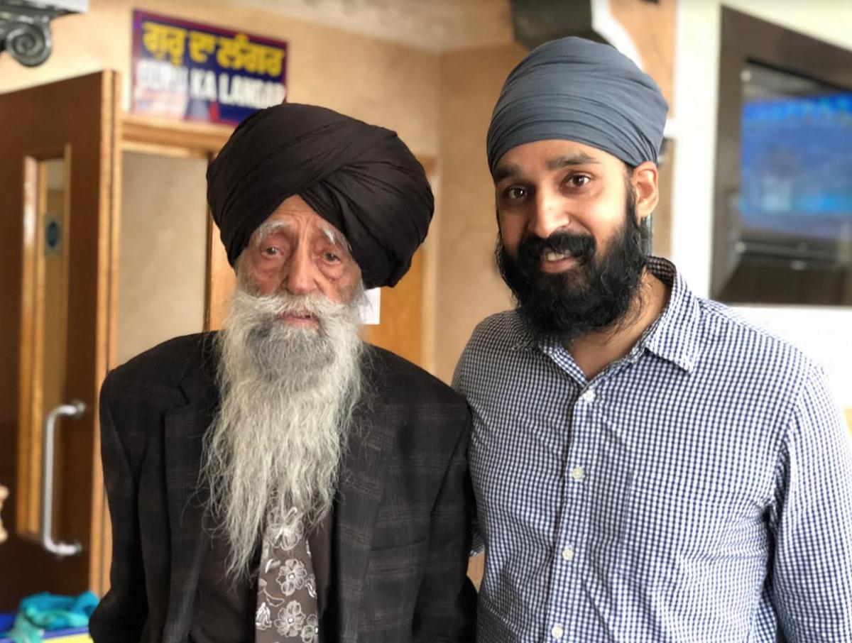 A photo of Fauja Singh and Simran Jeet Singh.