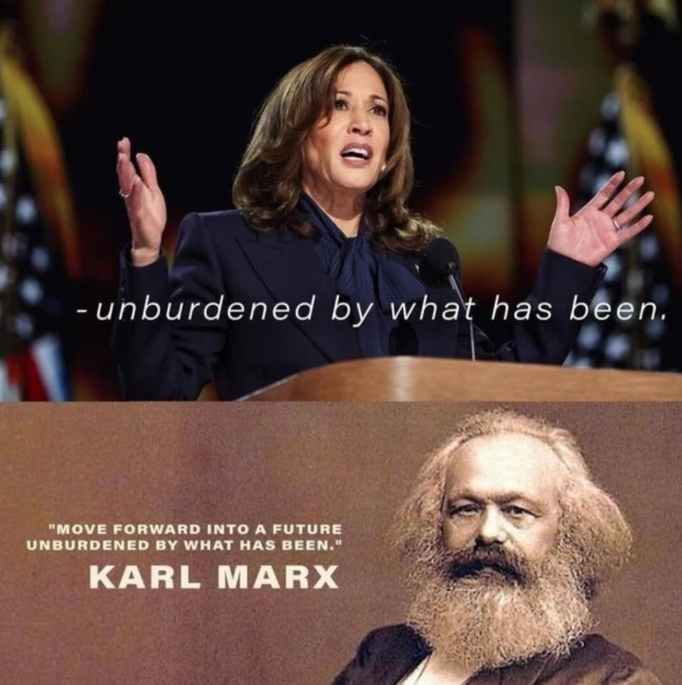 A person standing at a podium with a person in the background

Description automatically generated