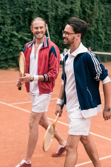 Two men holding tennis rackets on a tennis court

AI-generated content may be incorrect.