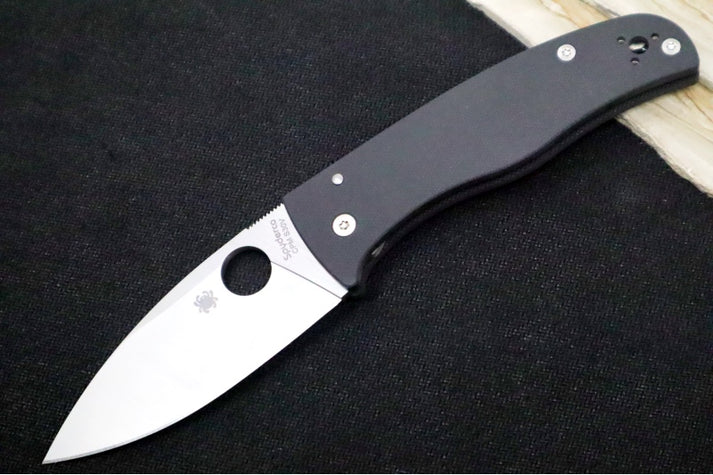 An image showcasing a Spyderco folding knife—the Bodacious designed by Sal Glesser. The knife has a leaf-shaped blade in CPM-S30V steel and black G-10 handles with stainless steel liners.