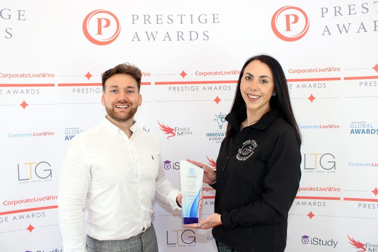 Rachel collecting her award from Prestige Awards