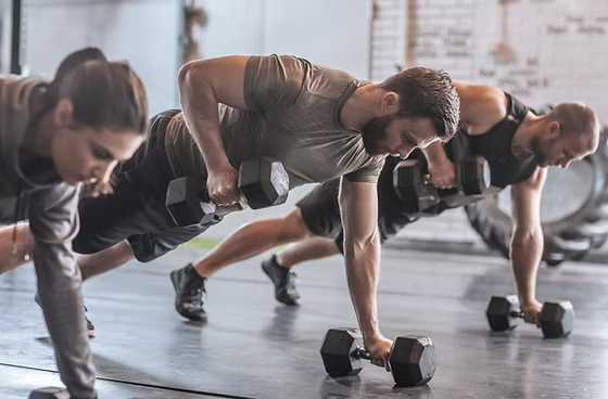 3 individuals are seen performing heavy exercise.