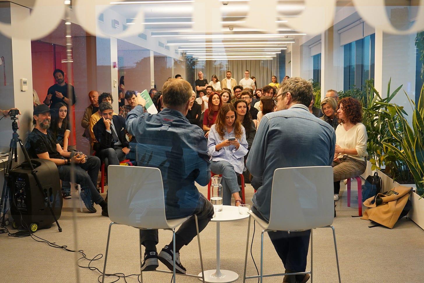 A group of people sitting in a circle

AI-generated content may be incorrect.