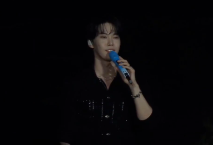 This contains an image of  Doyoung during his performance