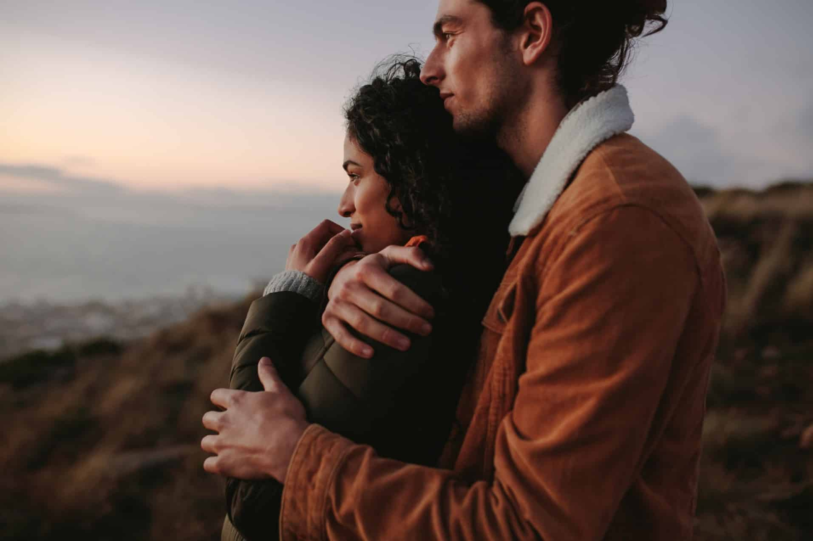 Couples hugging each other and enjoying the beautiful view.