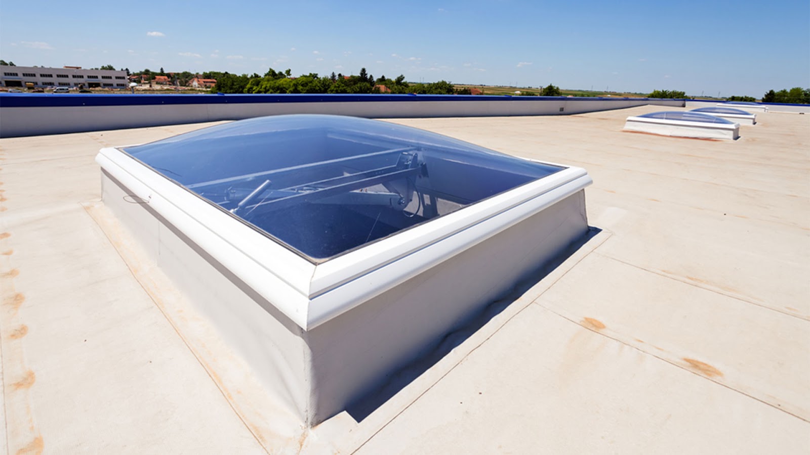 A newly installed flat roof skylight with hydro-insulation membranes, enhancing natural light and energy efficiency.