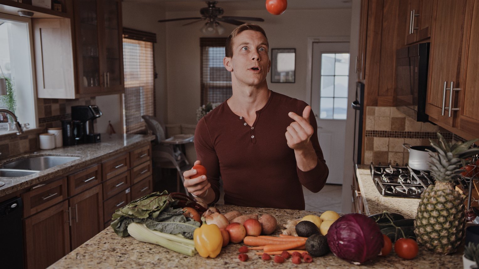 LifeUP Health Coaching LLC - Helping parents get healthy through diet, exercise and sleep. Trainer tossing an apple.