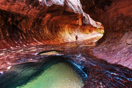 A person standing in a canyon

AI-generated content may be incorrect.