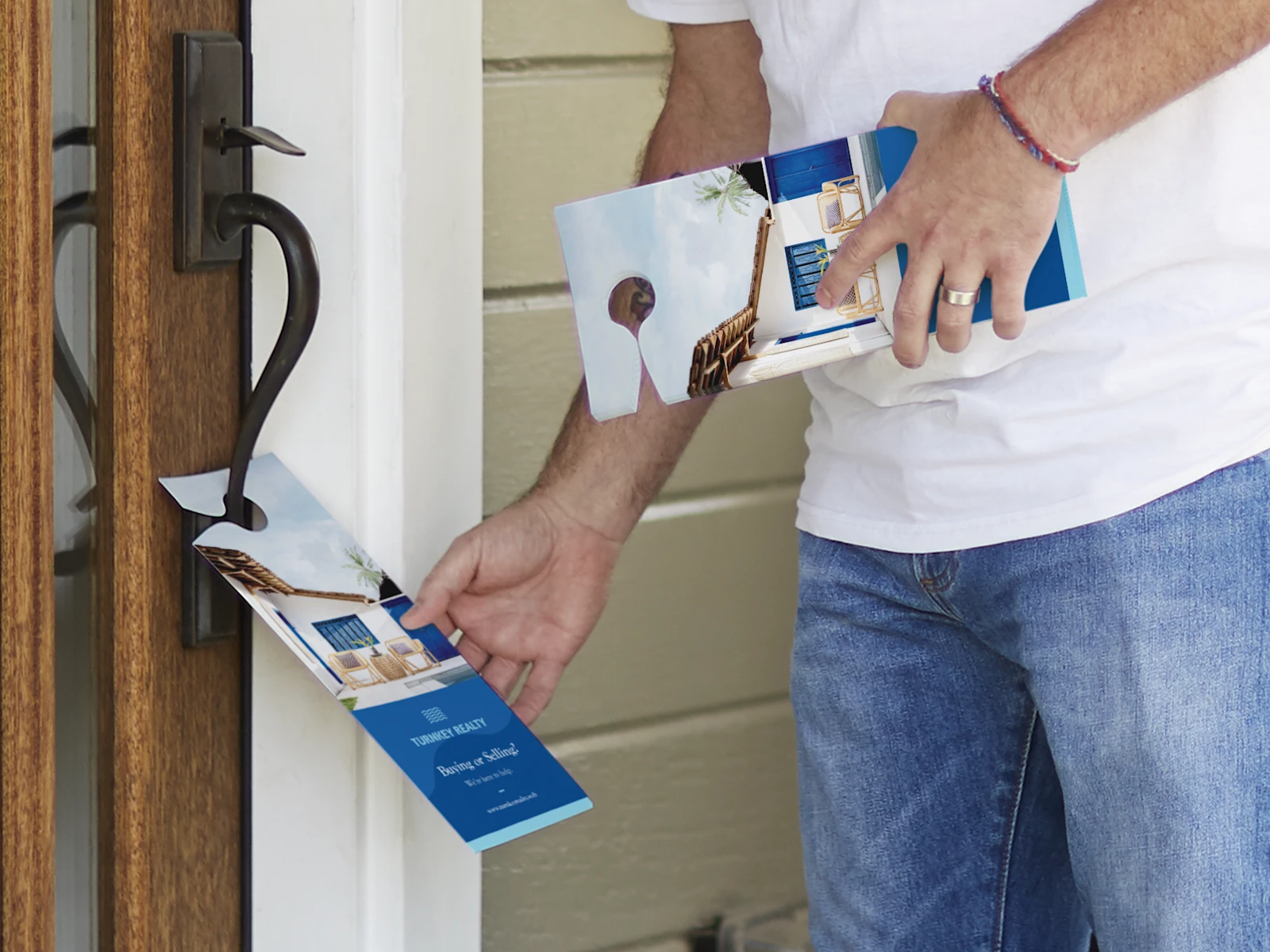 Door hanger marketing campaign example of someone placing a door hanger on a wooden door