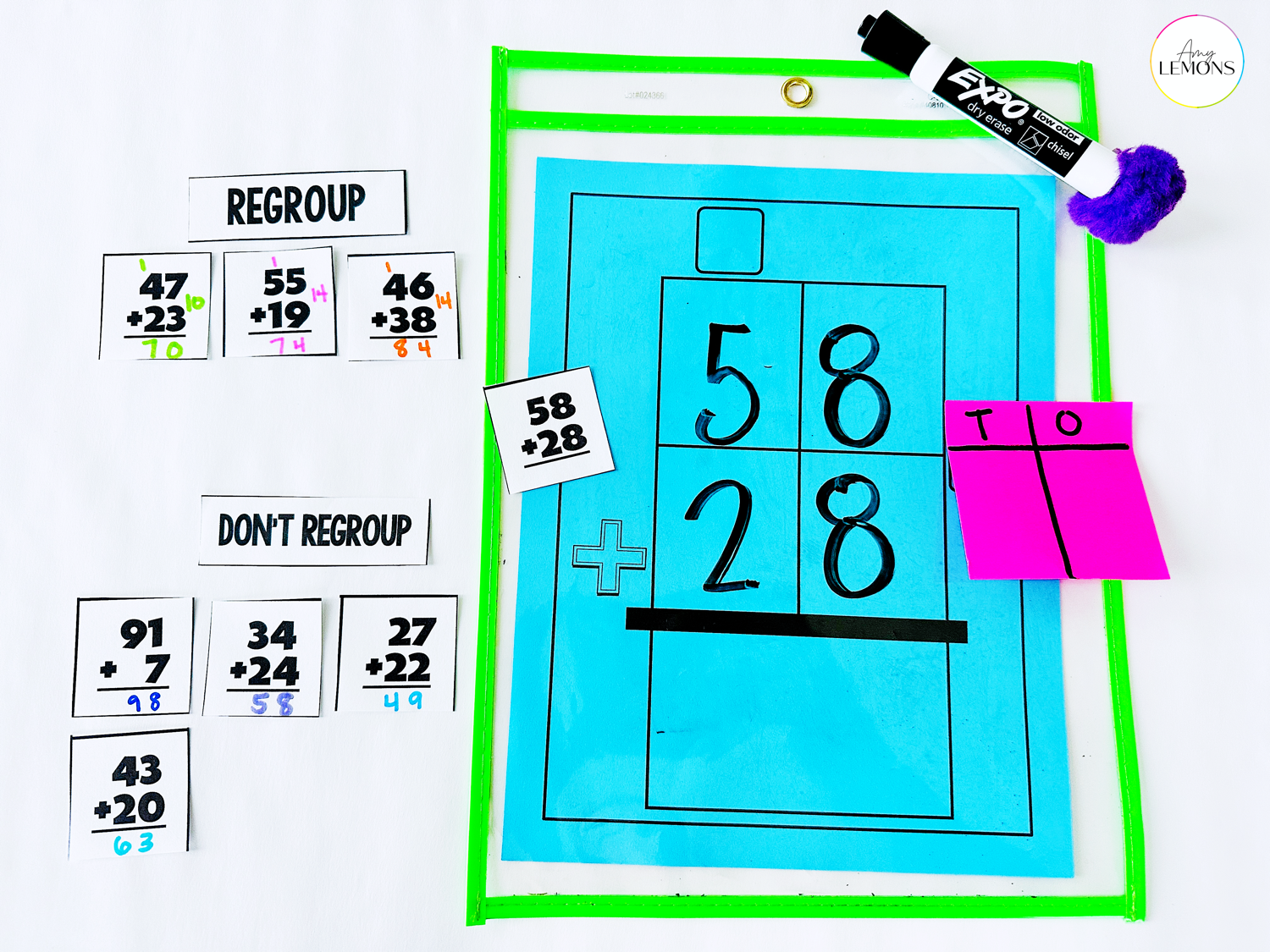 Sticky note method used in strategies for teaching addition with regrouping. Students split sticky note into tens and ones to show regrouping.