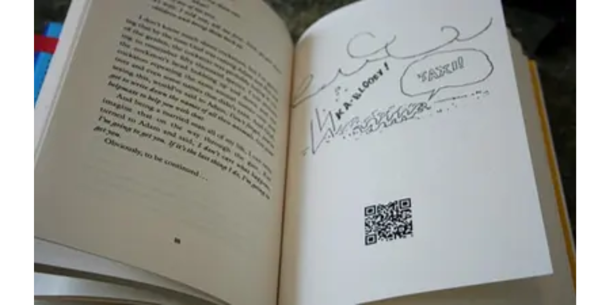 A QR Code printed on a page of a book.