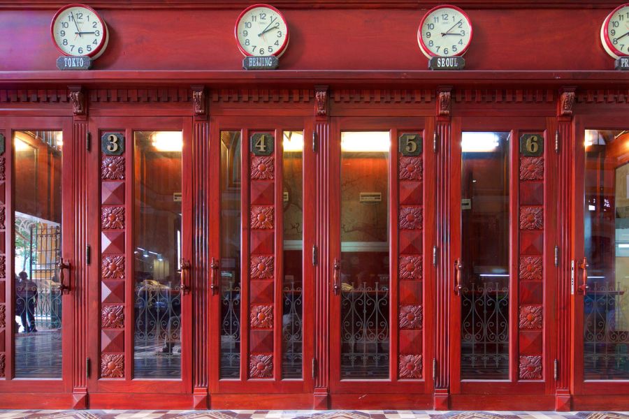 The post office still retains old mailboxes, telephone booths.