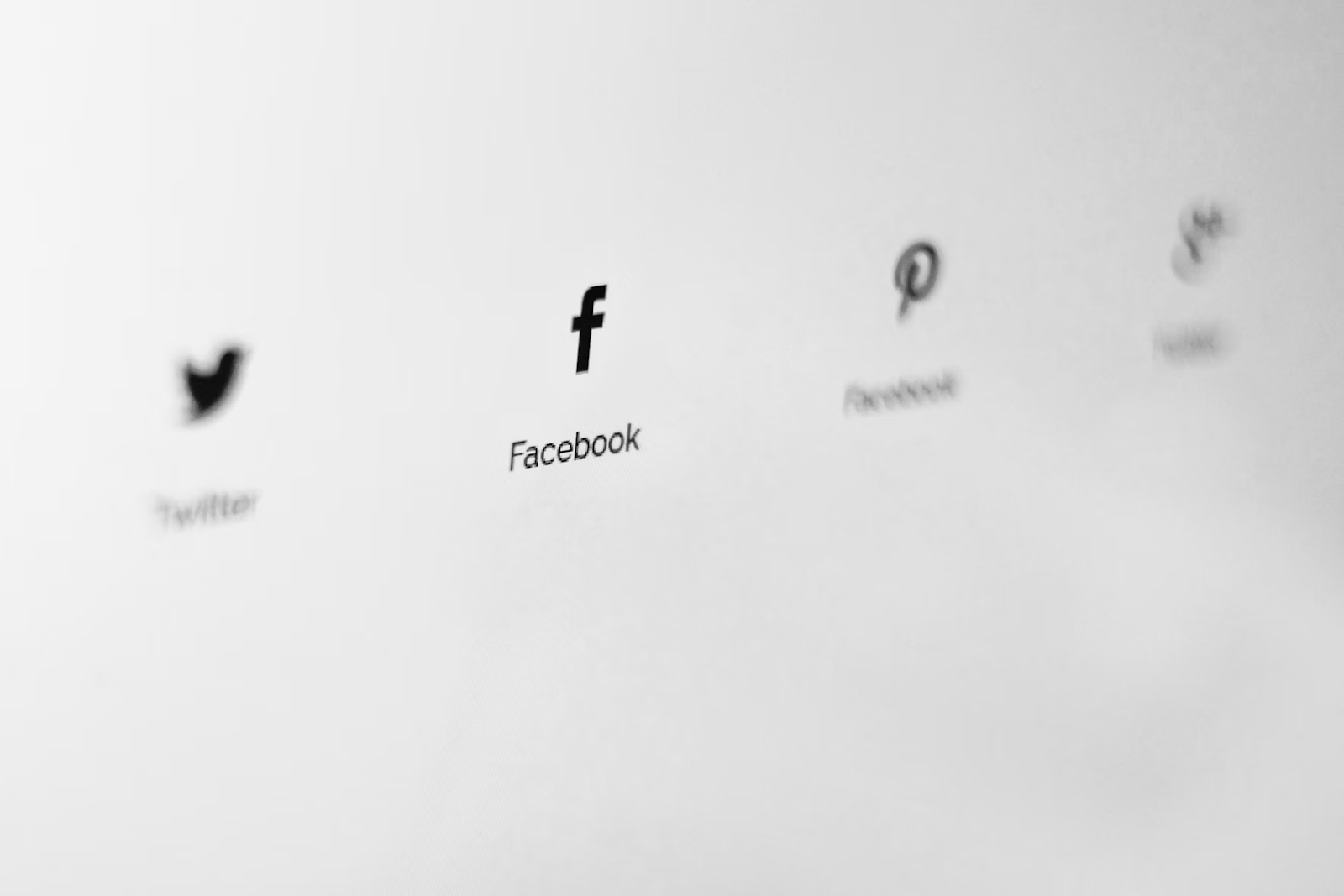 Social media logos on a white screen