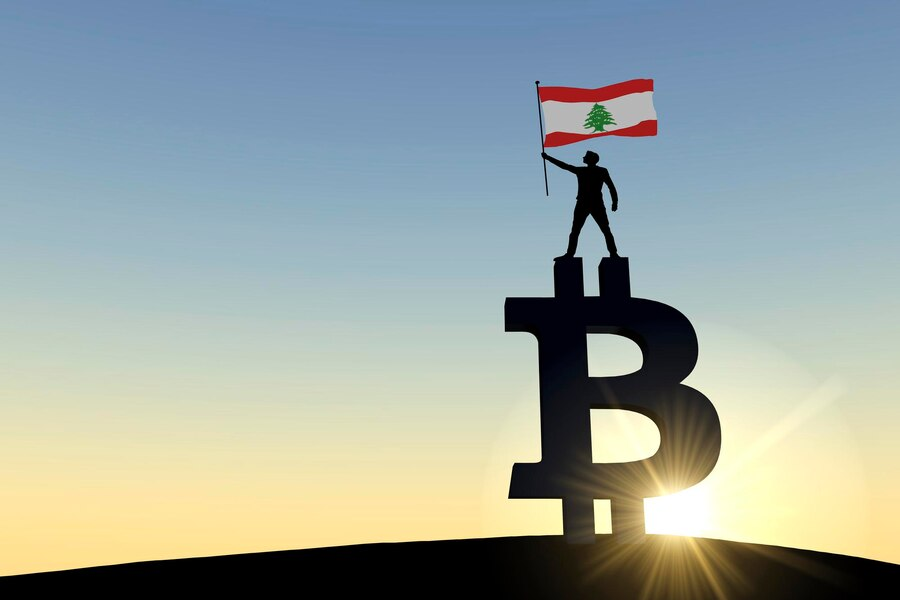 A person holding a Lebanese flag while standing on a Bitcoin symbol.