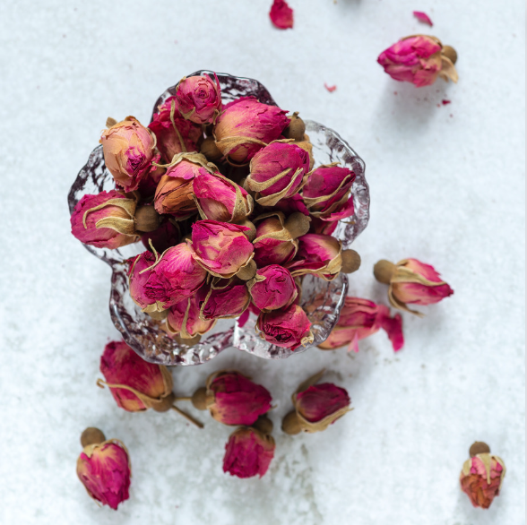 red rose buds in a bowl