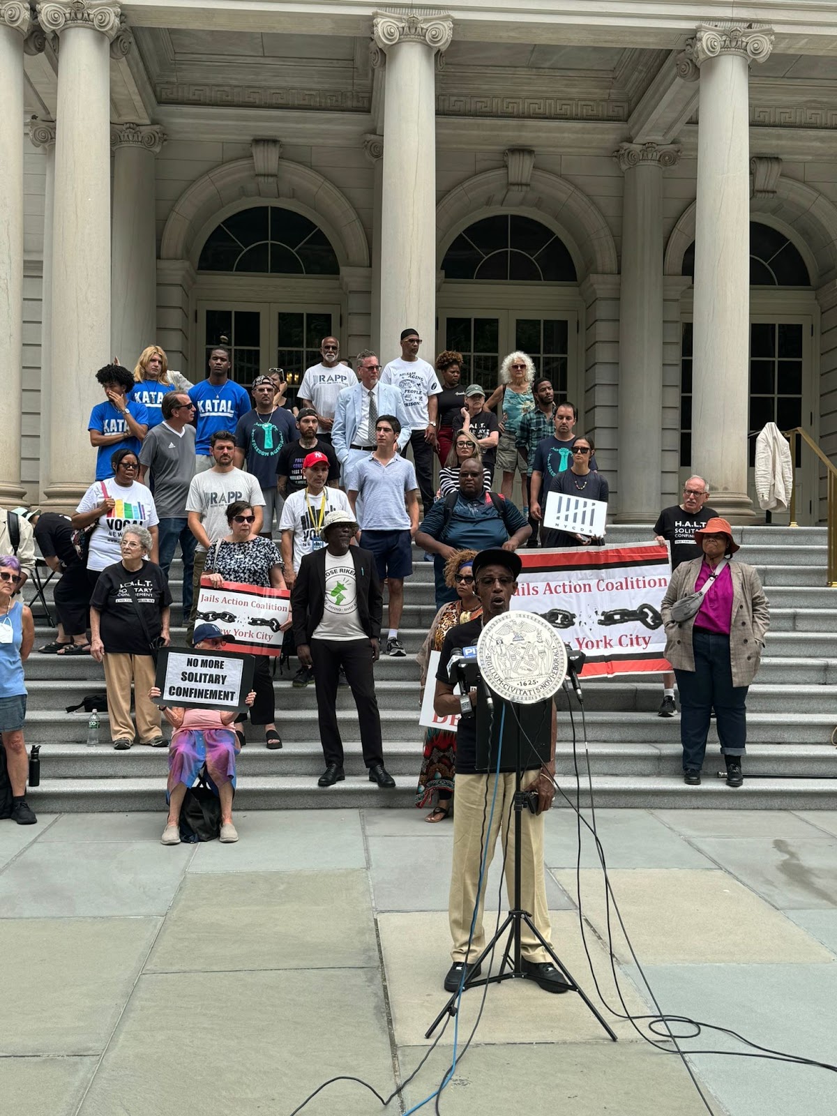 Katal staff interns gathered with allies at the #HALTSolitary rally at City Hall on Jul 29, 2024