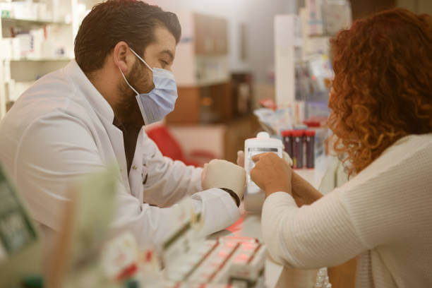 A friendly pharmacist assisting a customer, emphasizing personalized healthcare and expert guidance.