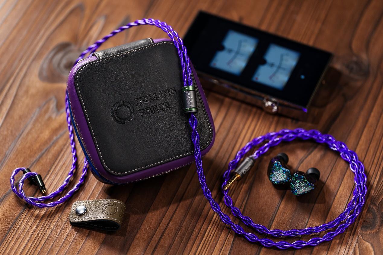 A purple and black earbuds and a small device

Description automatically generated with medium confidence