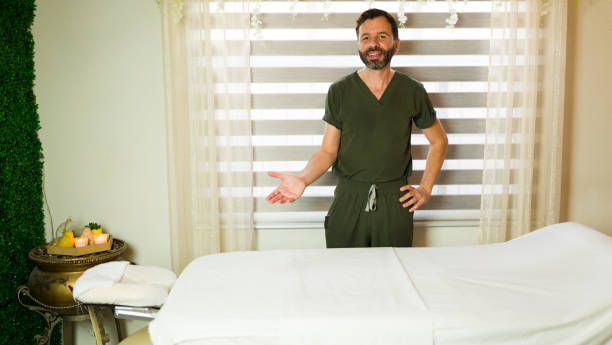 Massage therapist smiling after a session where the client showed appreciation with a tip.