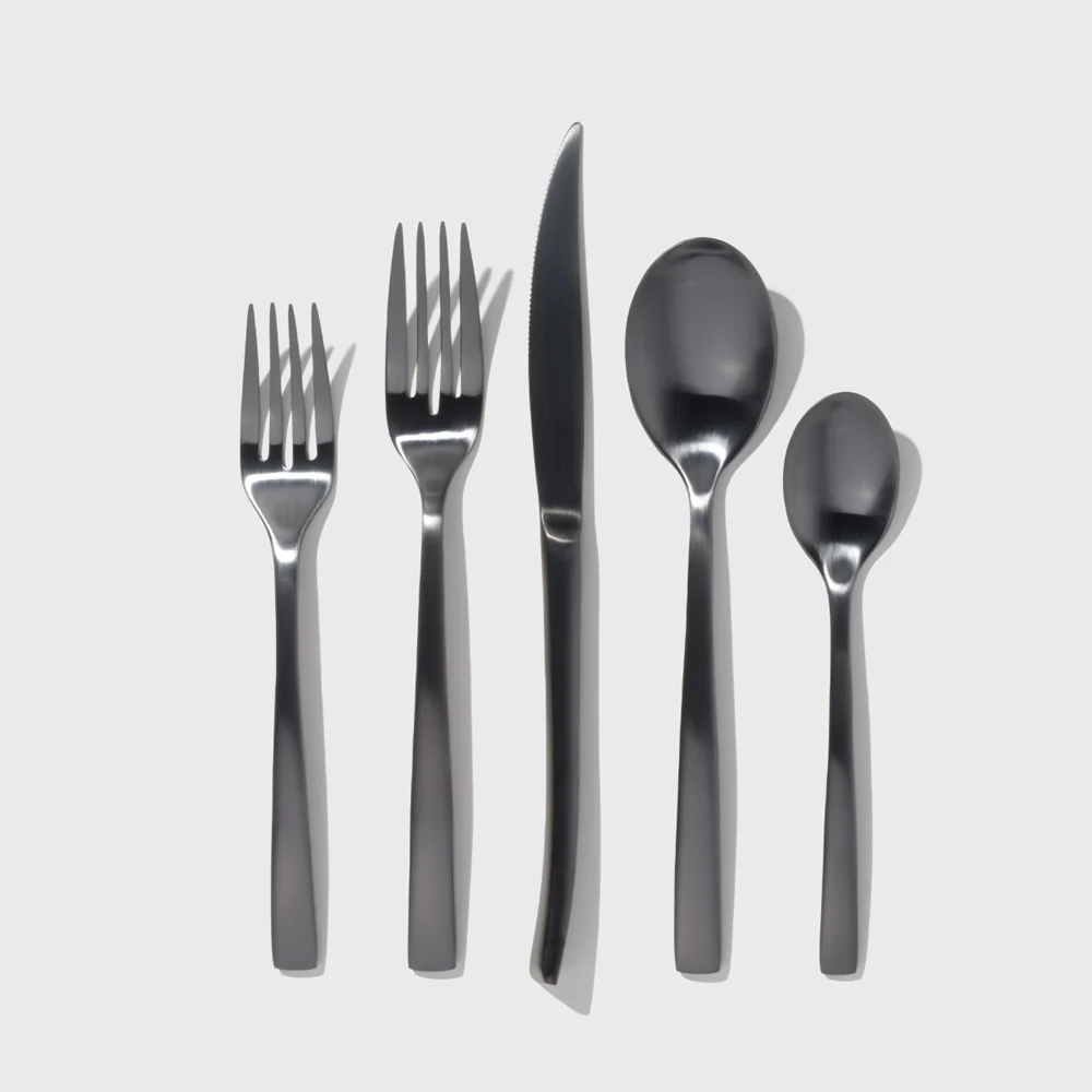 Non-toxic stainless steel flatware set: forks, knife, and spoons.