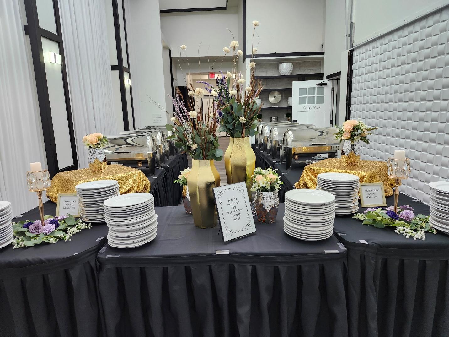 A table with plates and flowers
