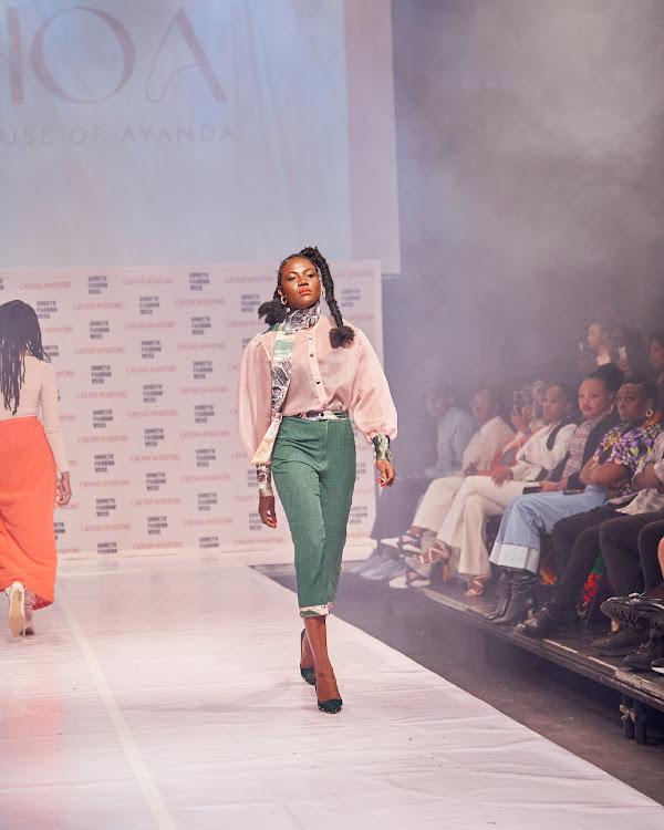 Model walks the runway in House of Ayanda designs at Soweto Fashion Week