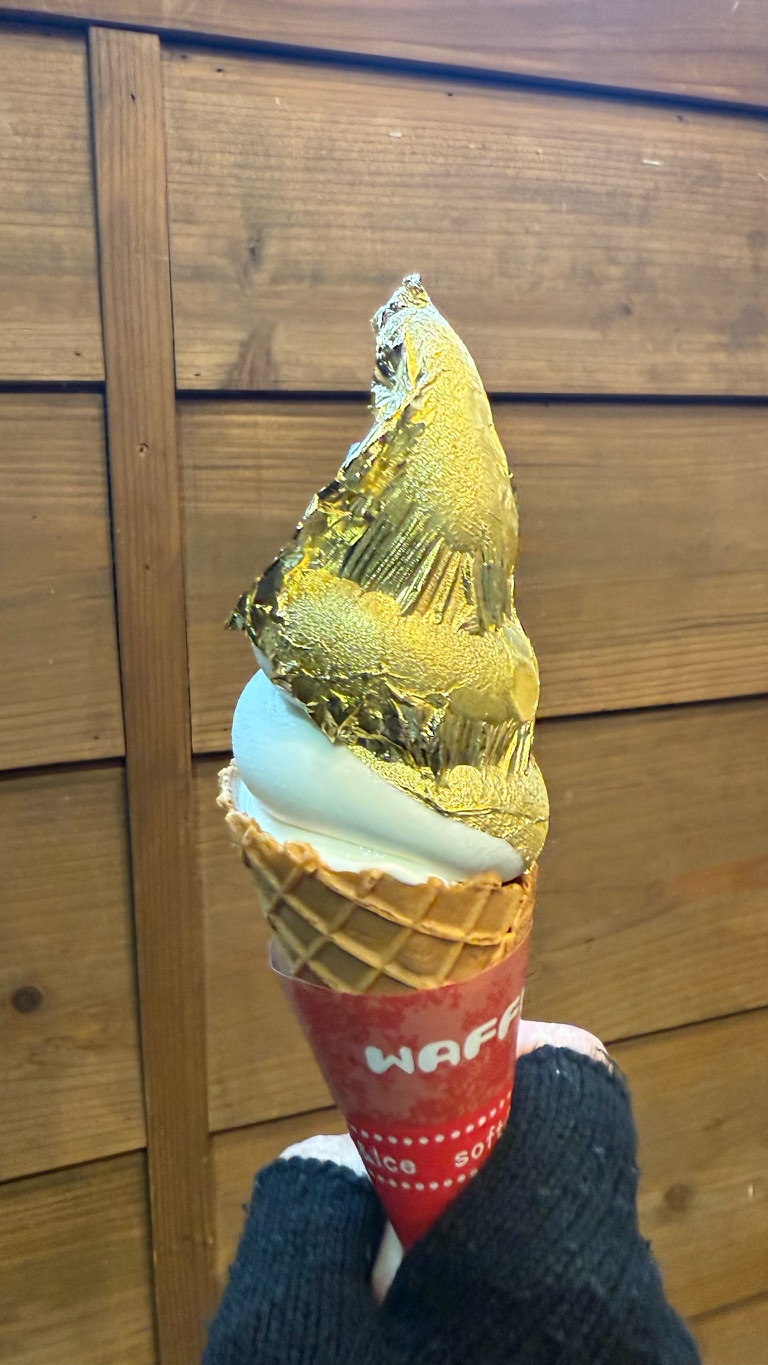 A hand holding golf leave ice cream at Omicho Market