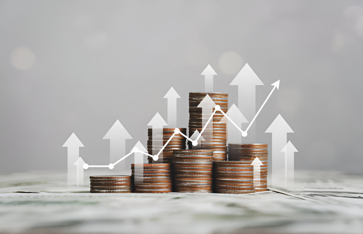 Stacks of coins with upward-pointing arrows and a rising line graph, symbolizing informed investment decisions