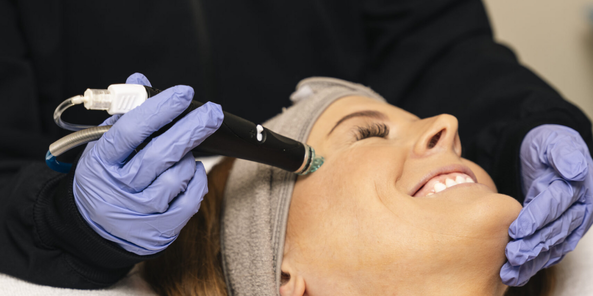 A woman receiving a laser facial treatment, showcasing advanced skincare technology for effective results.