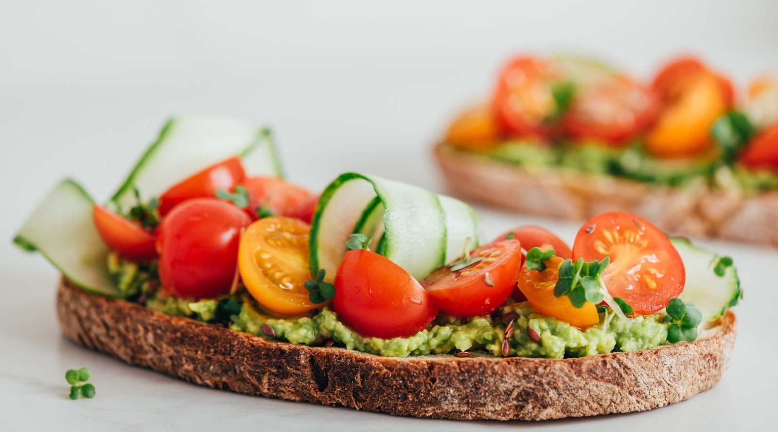 Avocado toast with fresh vegetables at a top healthy restaurant in Toronto