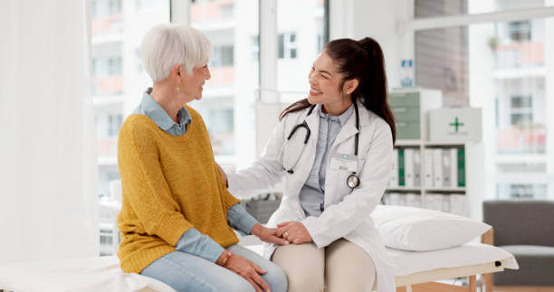 Smiling doctor with patient in a wellness clinic, representing compassionate and holistic care approach.