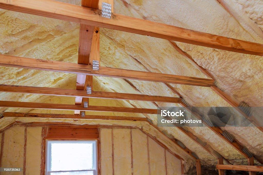 Foam plastic Insulation on a new roof Foam plastic Insulation of a new home on a new roof Insulation Stock Photo