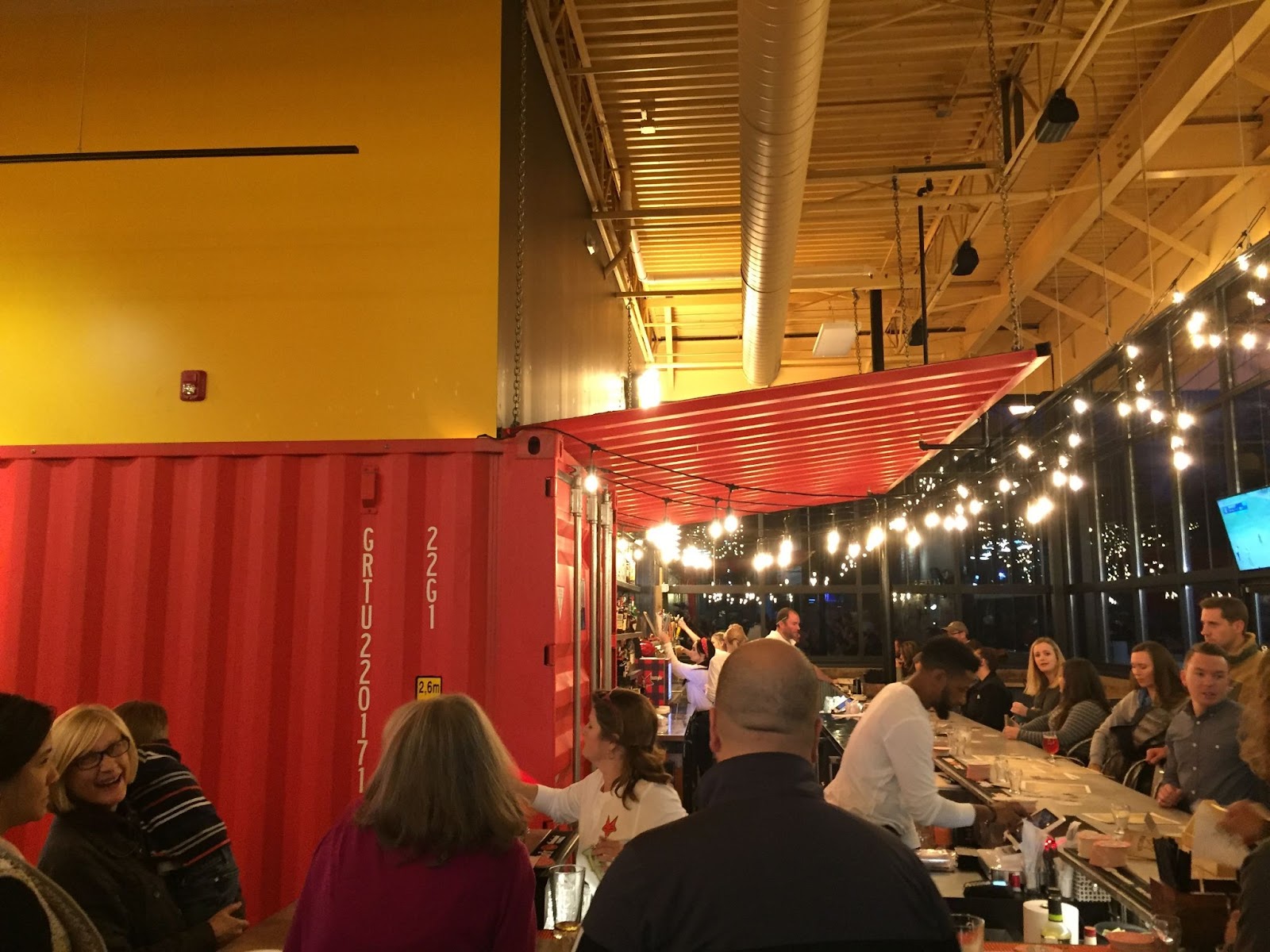 shipping container modified for restaurant as bar front