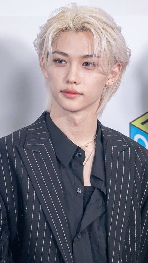 This contains an image of Stray Kids' Felix 