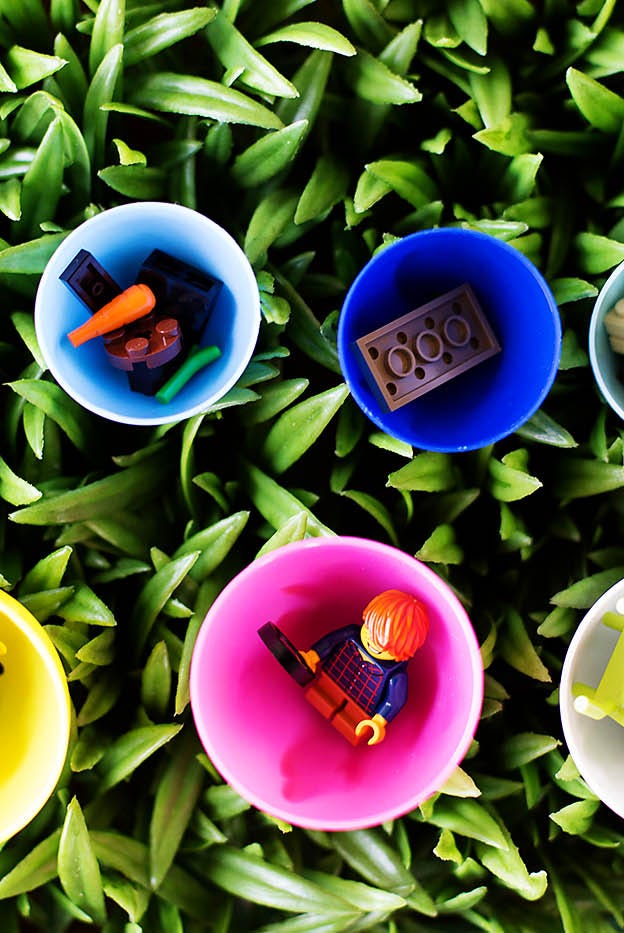 easter egg hunt ideas, legos in colorful cups in the grass