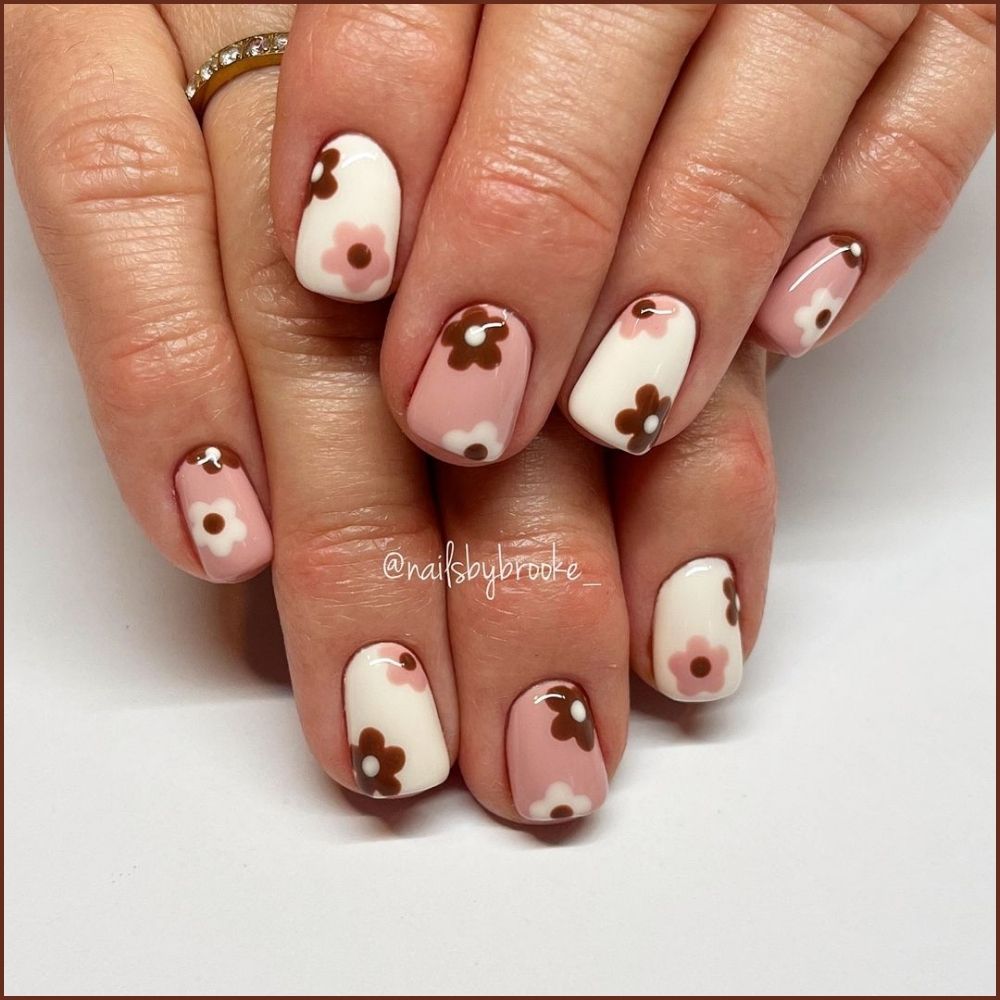 Close up of flowered short nail design with Ice cream colors