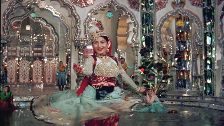 This may contain: a woman is dancing in an elaborately decorated room