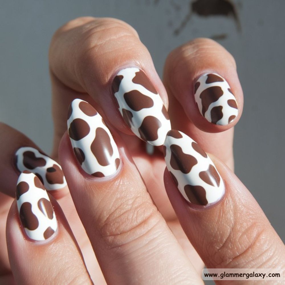 Almond Shaped Nails having Playful Cow Print