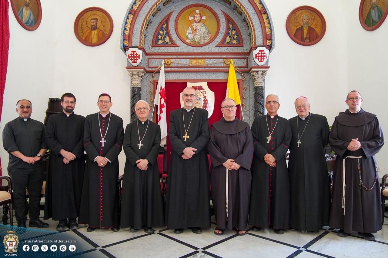 A group of men in black robes

Description automatically generated