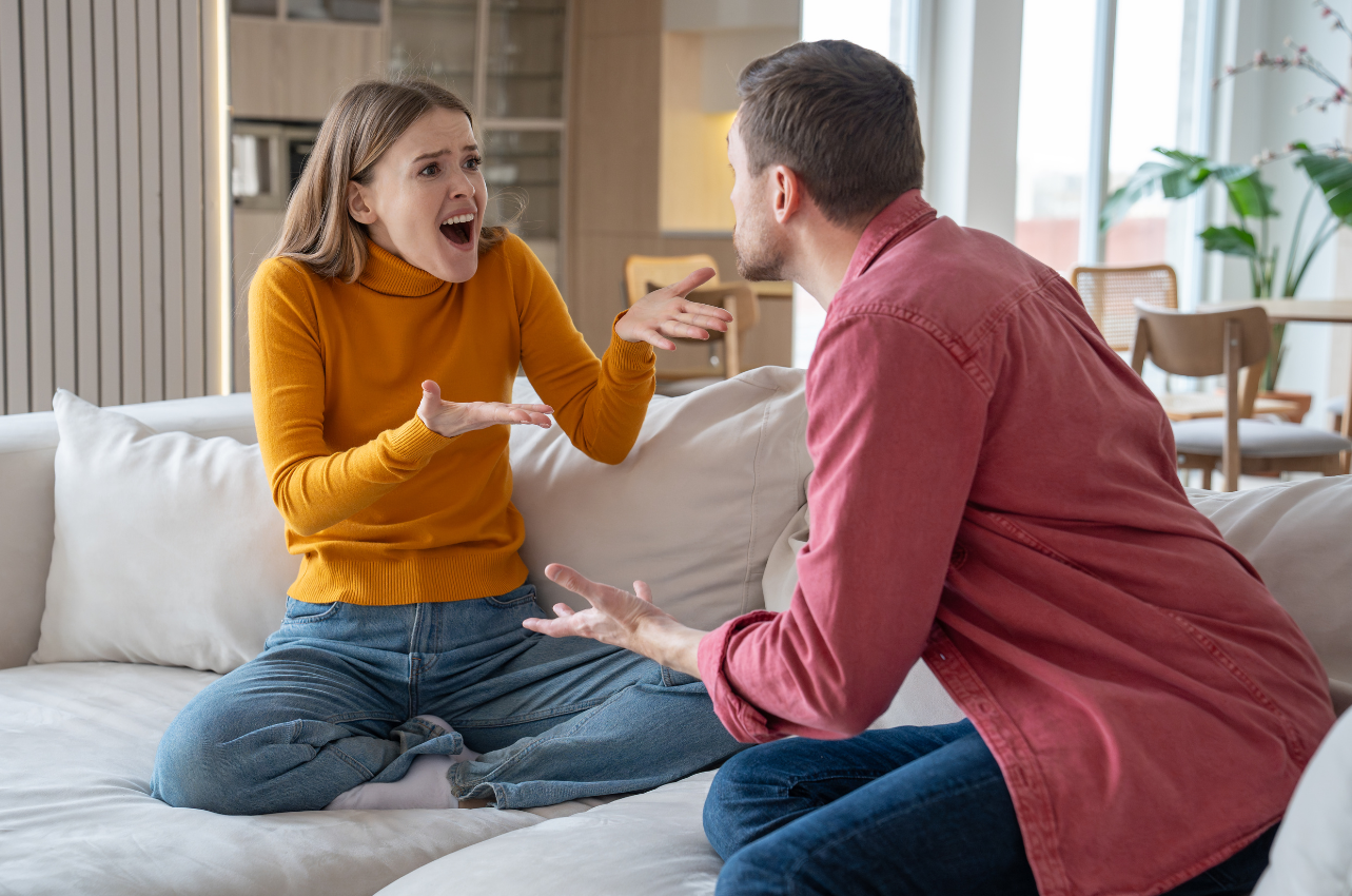 Woman being gaslit by a man on the couch // Healthier Baby Today 