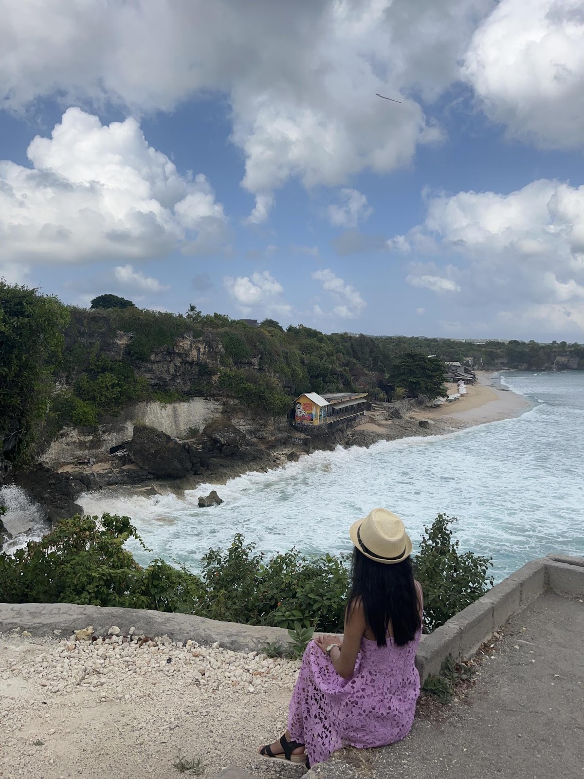 viewpoint in uluwatu overlooking the ocean tides below. 