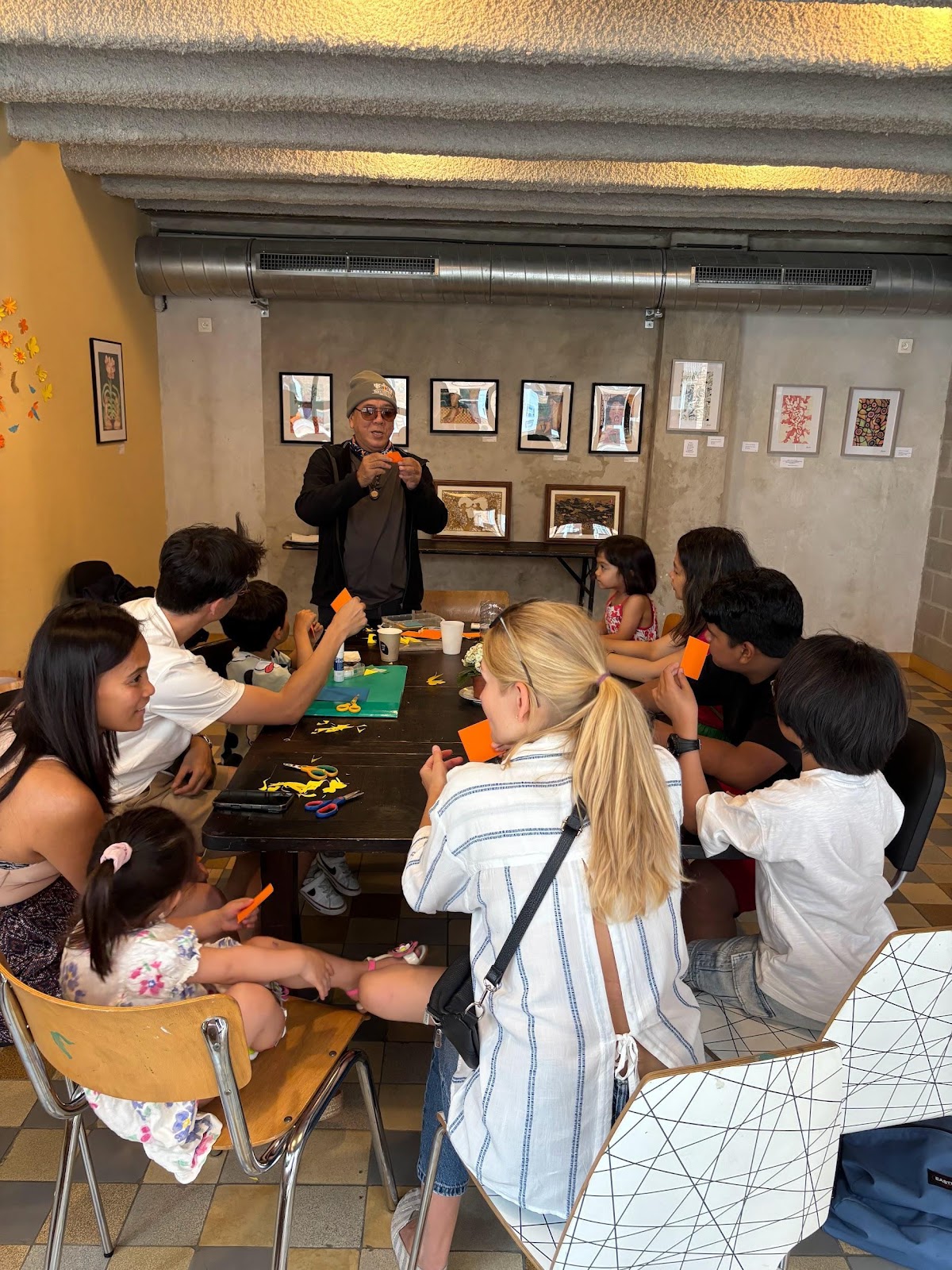 A group of people sitting around a tableAI-generated content may be incorrect.