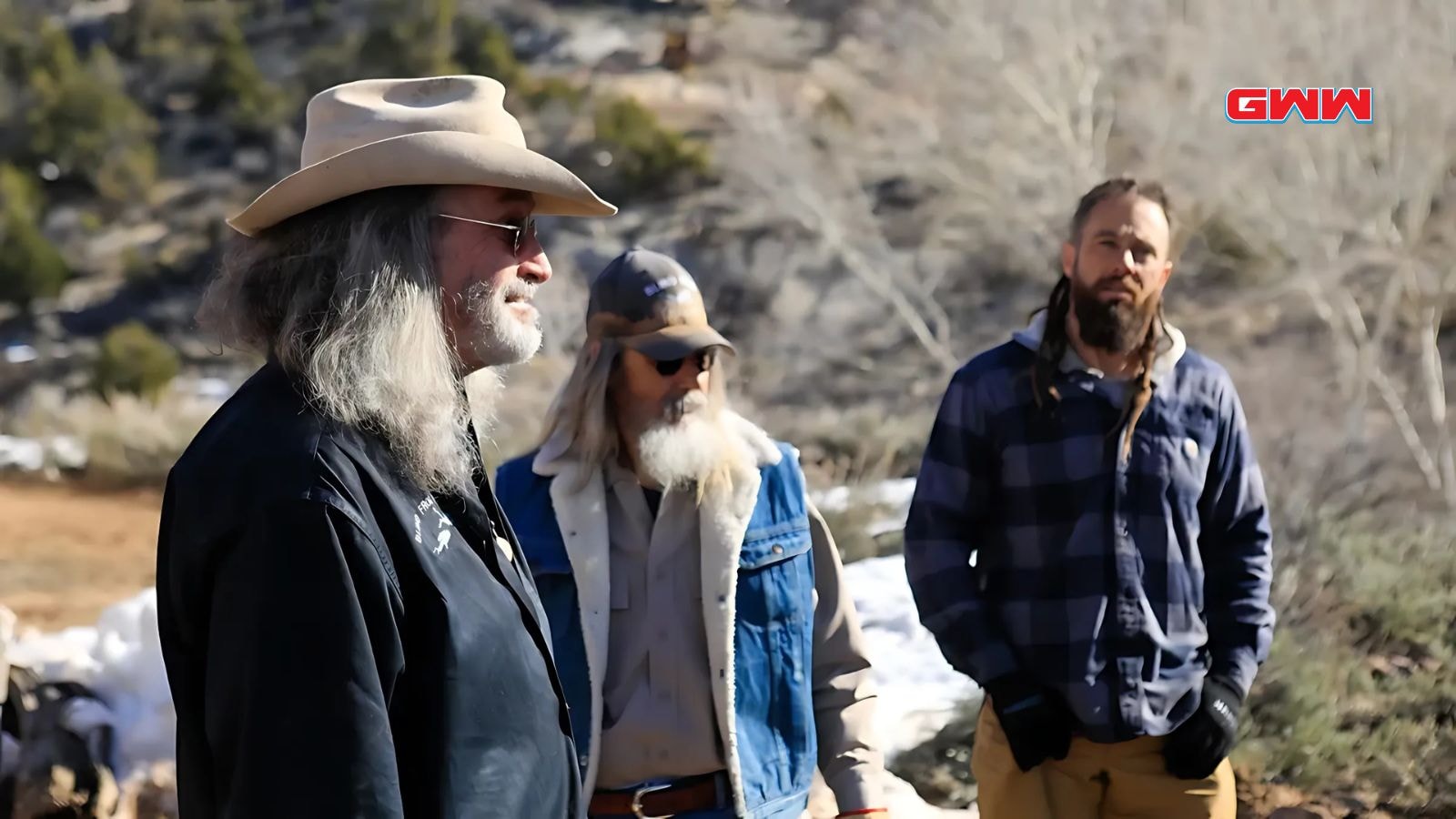 Duane Ollinger with team strategizing about excavation at Blind Frog Ranch