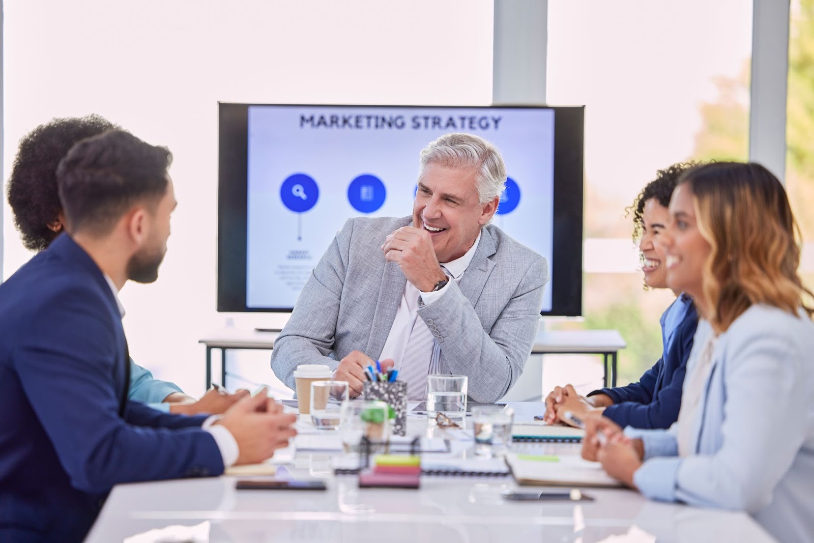 A male CEO having a meeting with a marketing team. 