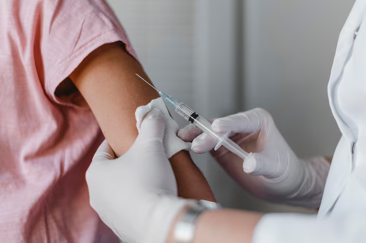 a-healthcare-worker-wearing-gloves-administering-a-vaccine-injection-to-a-patient's-arm-with-a-syringe-the-thymogen-protocol-for-post-cycle-shutdown-and-immune-burnout-tony-huge