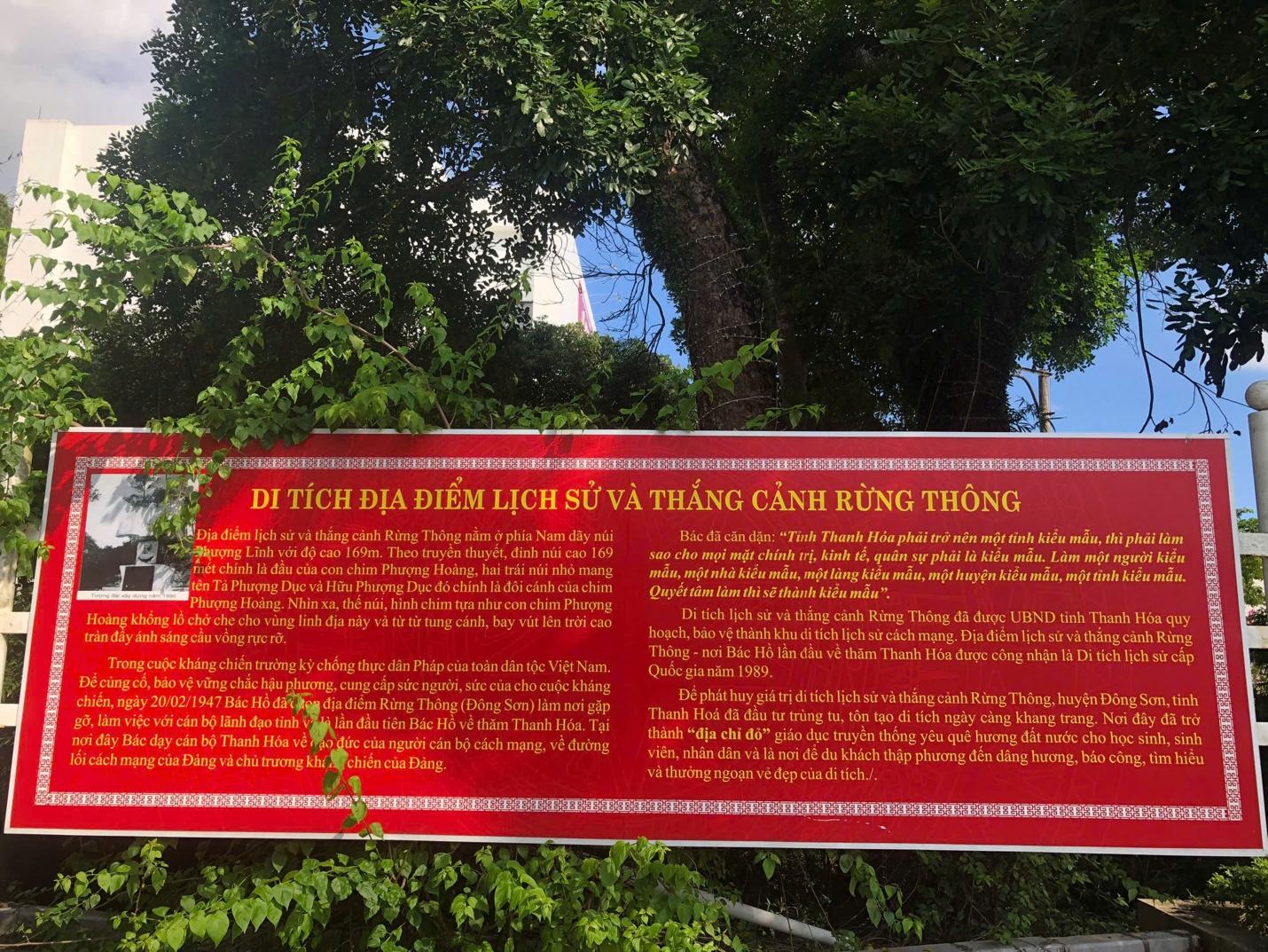 A red sign with yellow text

Description automatically generated