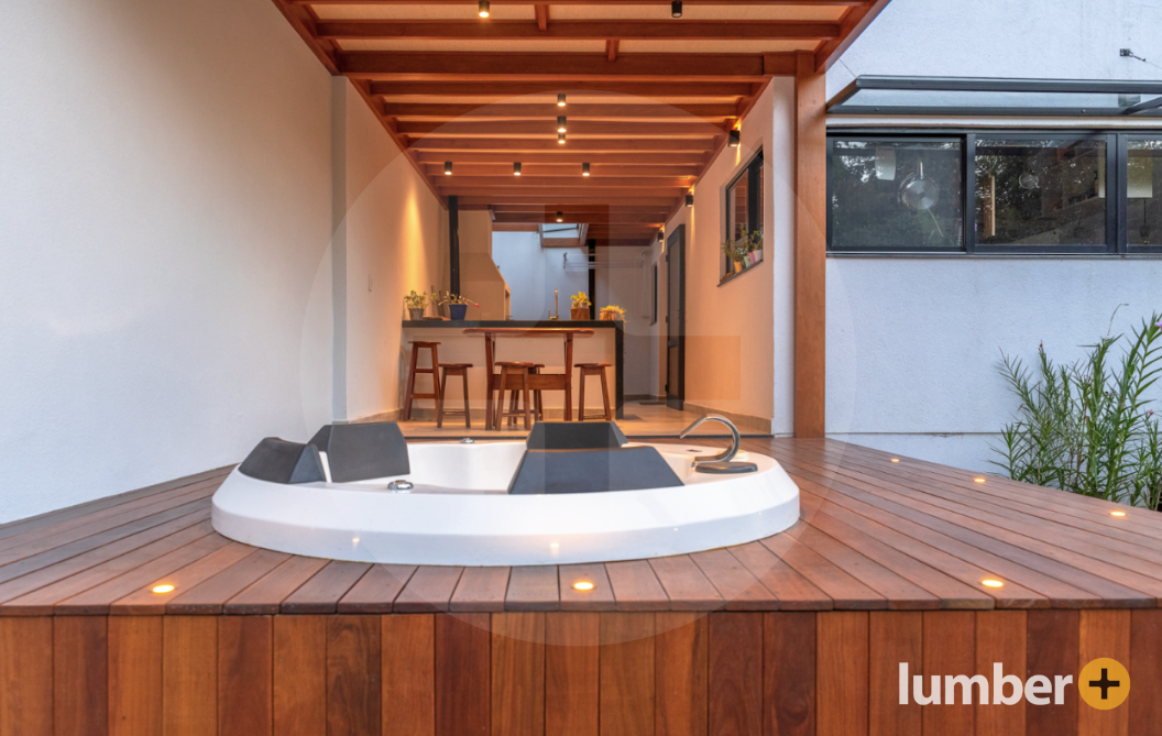 an image of a hardwood deck from Lumber Plus around a hot tub.