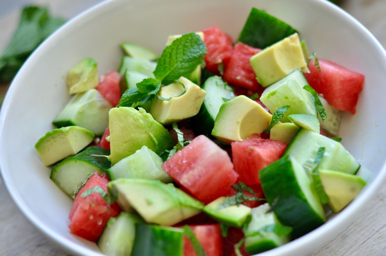 Bowl of fruit with watermelon, cucumber, avocado, mint, Foods for fertility
