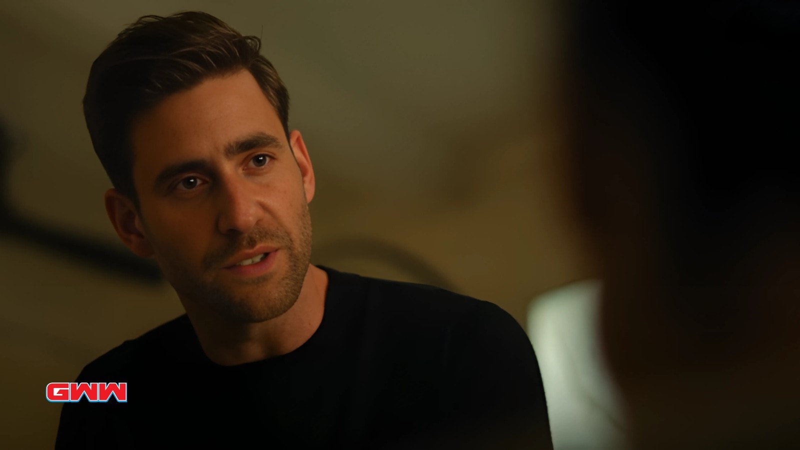 Oliver Jackson-Cohen speaking seriously in an intense moment from Surface