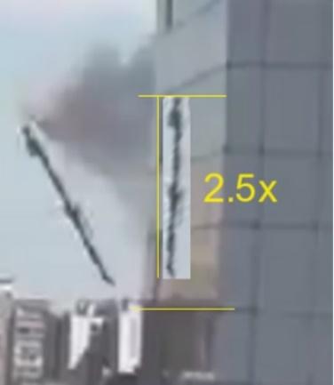 A building with a crane and smoke coming out of it

Description automatically generated